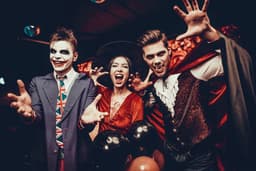 Three people dressed up in Halloween Costumes