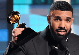 Drake holding a Grammy Award