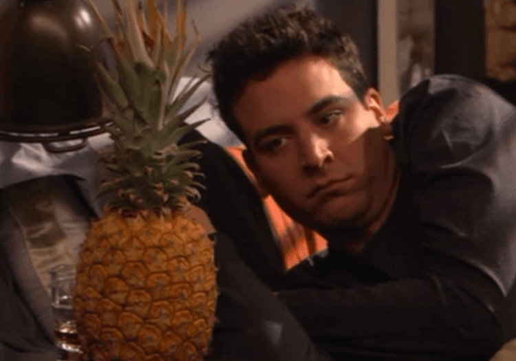 Ted looking at a pineapple in How I Met Your Mother